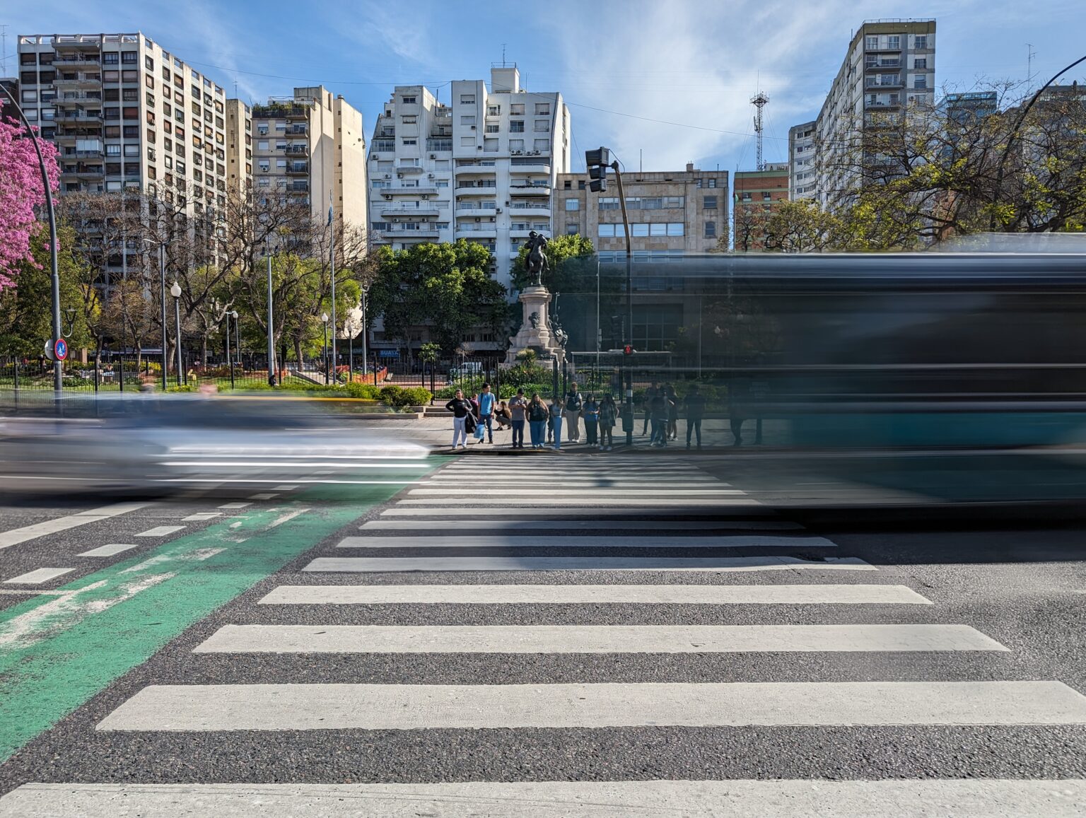 Buses and cars flying through an intersection in Buenos Aires, Argentina