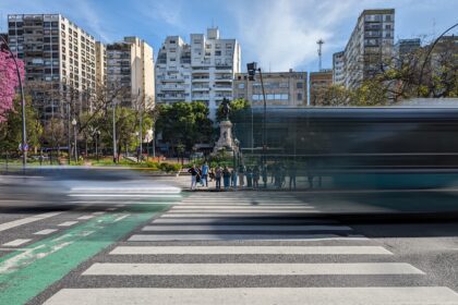 Buses and cars flying through an intersection - Buenos Aires transportation