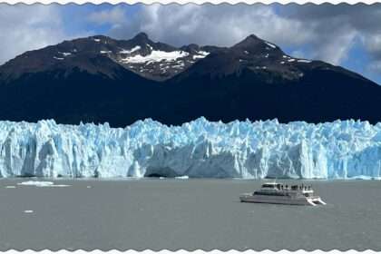 A boat sailing near the Perito Moreno glacier in the water outside of El Calafate