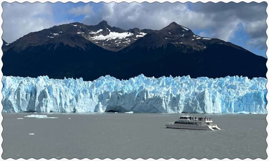A boat sailing near the Perito Moreno glacier in the water outside of El Calafate