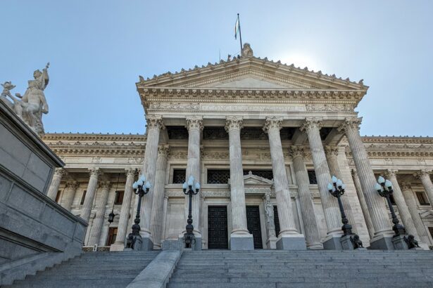 Upward angle of the Congress building in Buenos Aires with a blue sky.