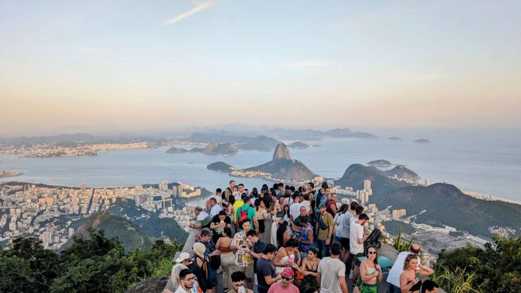 The crowds at the top of the Christ the Redeemer statue overlooking the city and bays of Rio de Janeiro