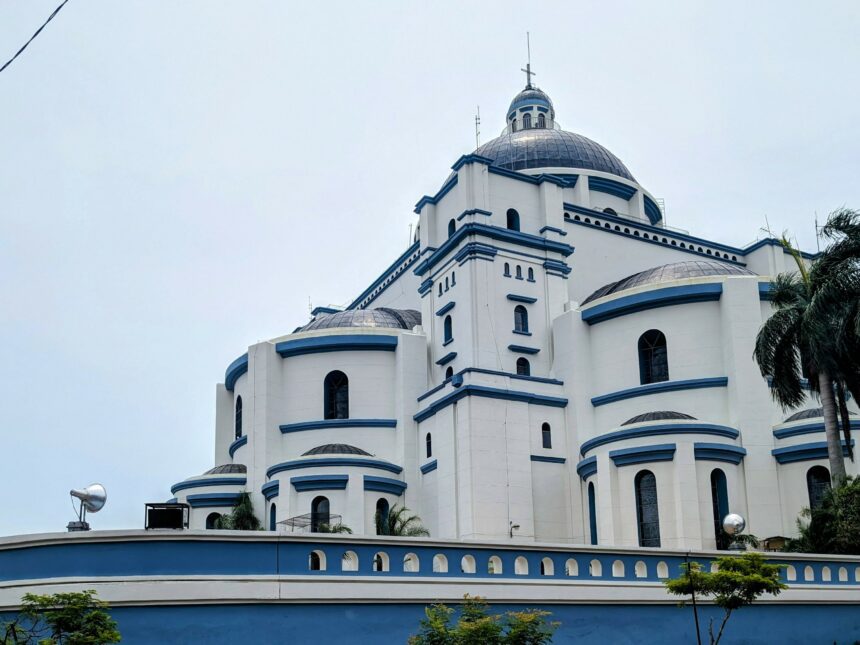 A blue and white cathedral in Paraguay that is part of the Circuito de Oro