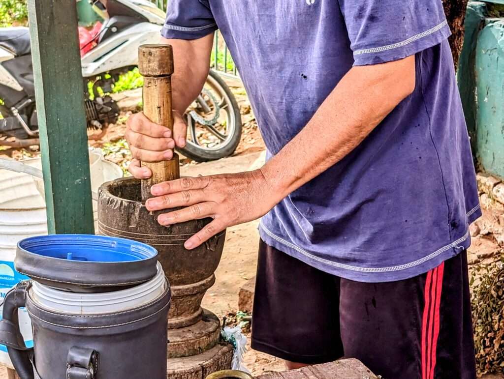 A man grinding herbs