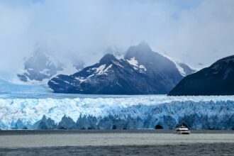 Boat in front of the Perito Moreno Glacier in Southern Patagonia, Argentina