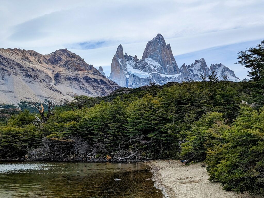 Serene lake nestled amidst towering mountains, offering a captivating view of nature's wonders.