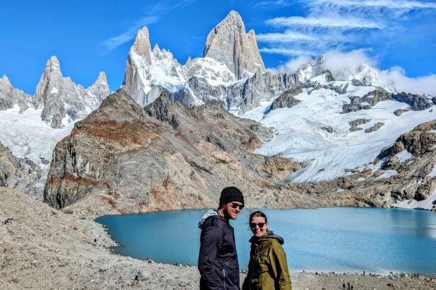 Two people enjoying the serene beauty of a mountain lake in El Chalten