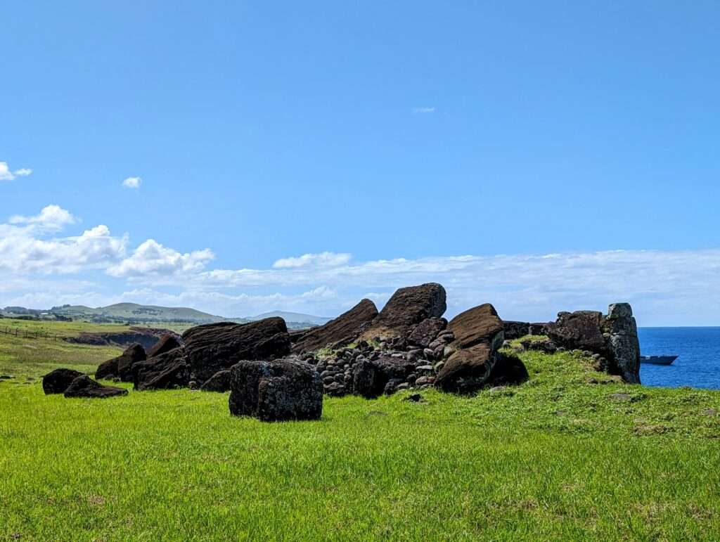 A pile of large carved stones toppled over - How to Visit Easter Island