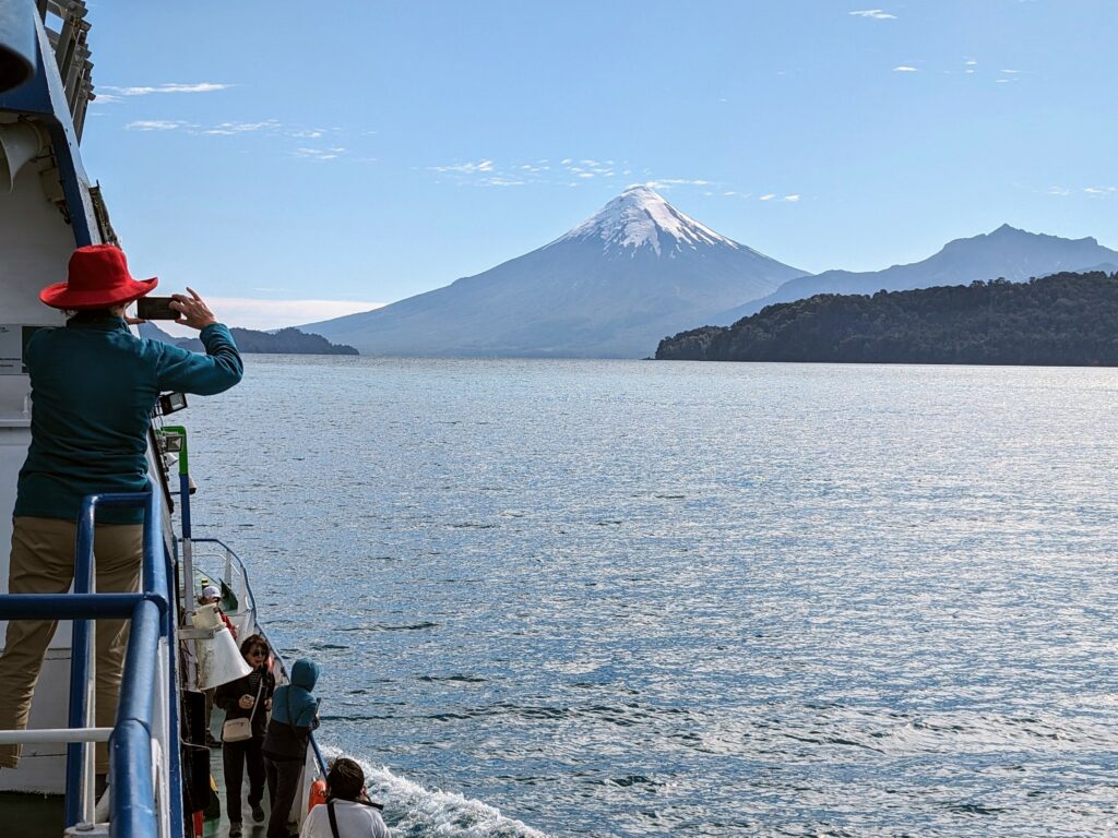 A volcano viewed from a ferry used to cross the border between Argentina and Chile near Bariloche and Puerto Varas