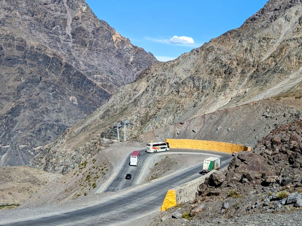 A windy road through some mountains driven to cross the border between Chile and Argentina