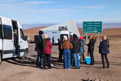 People waiting in line to cross a border - Bolivia tourist visa