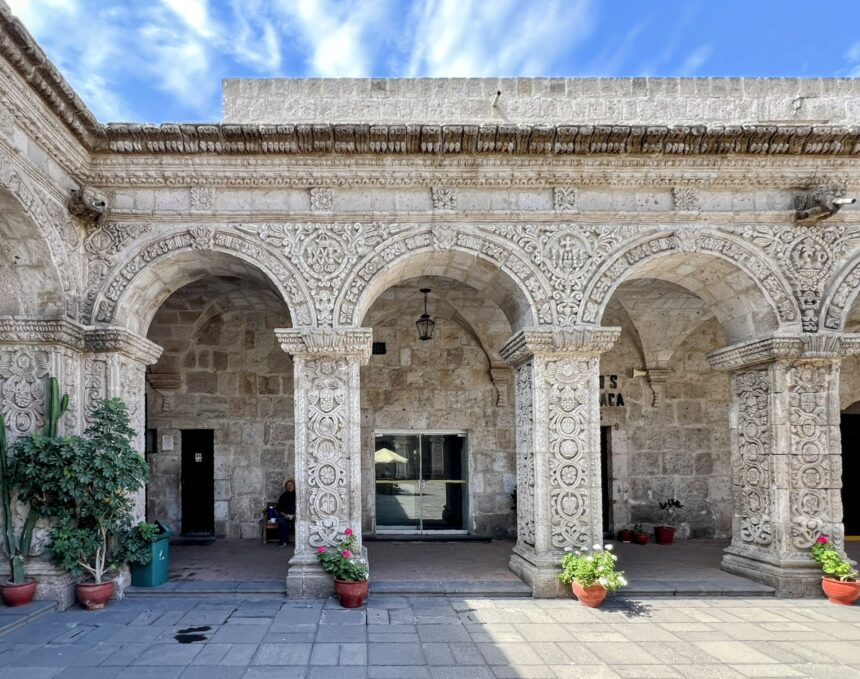 Detailed white arches carved into stone and one of the things to do in Arequipa