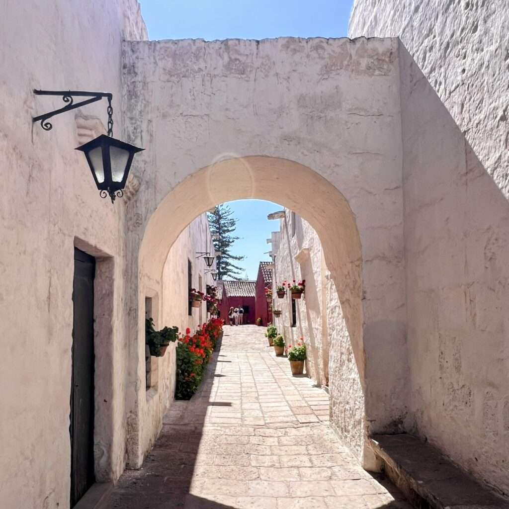 The white stone walls and archways of a monastery in Arequipa