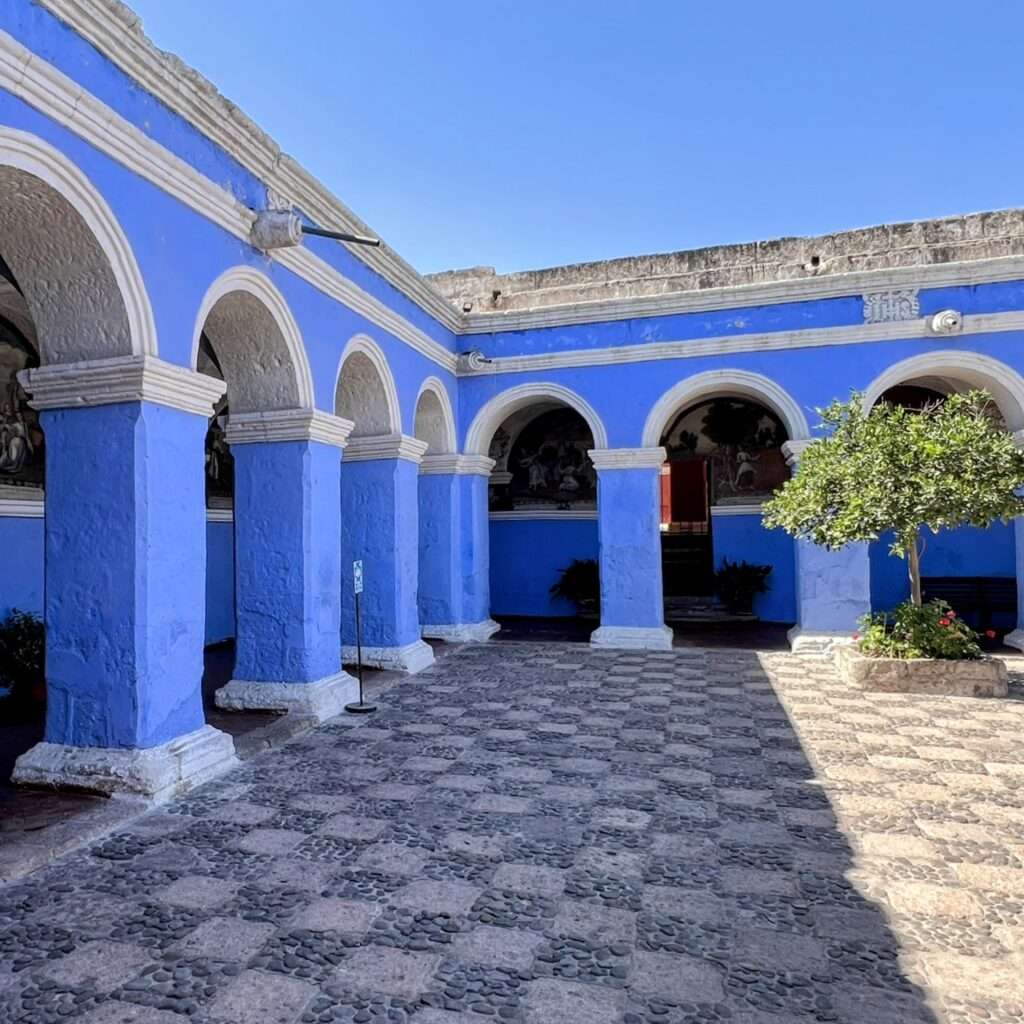 Light blue archways around a courtyard in Arequipa