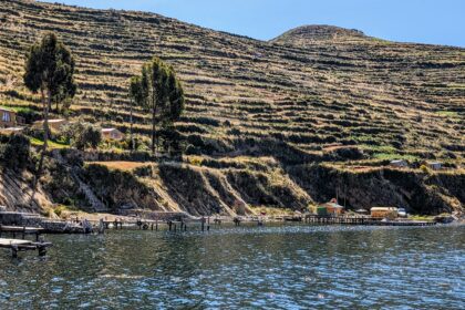 Terraces located on the side of a lake - things to do at Lake Titicaca