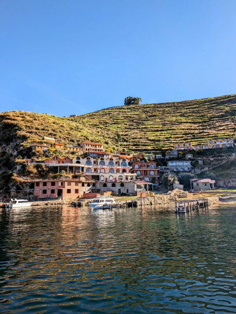 Buildings at the base of an island in Lake Titicaca