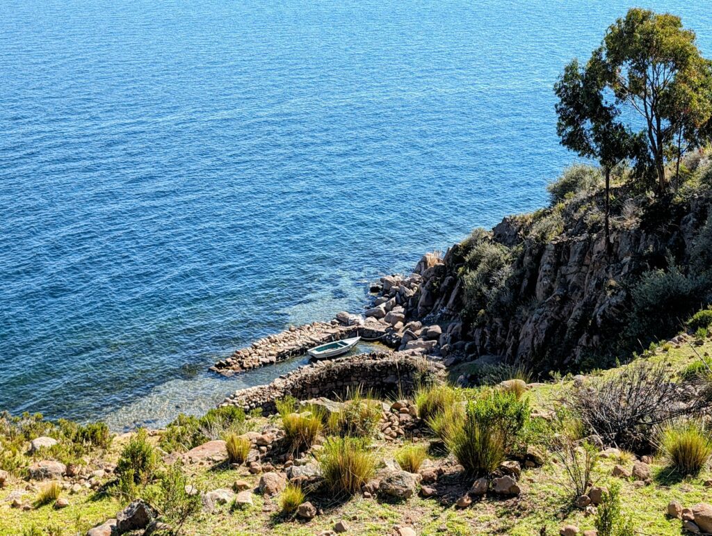 The view down an island with a boat dock on a Lake Titicaca homestay tour