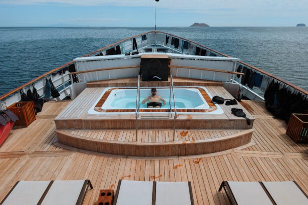 A person in the hot tub on the front of a Galapagos Islands yacht cruise with Quasar Expeditions