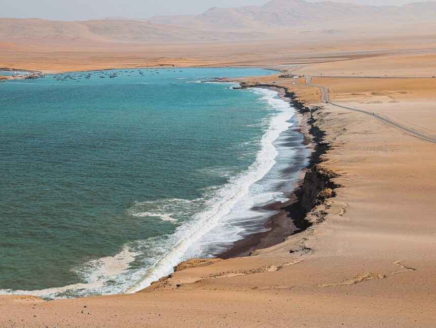 A view over the red sand beach at the Paracas National Preserve when going from Lima to Paracas