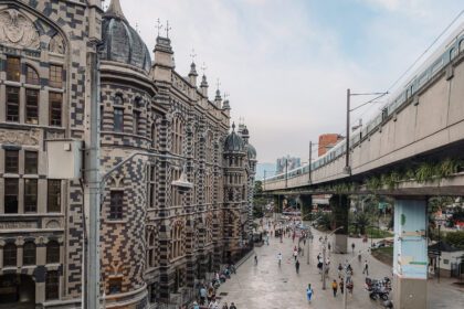 A view of the historic buildings and public tram of Medellin - things to do in Medellin