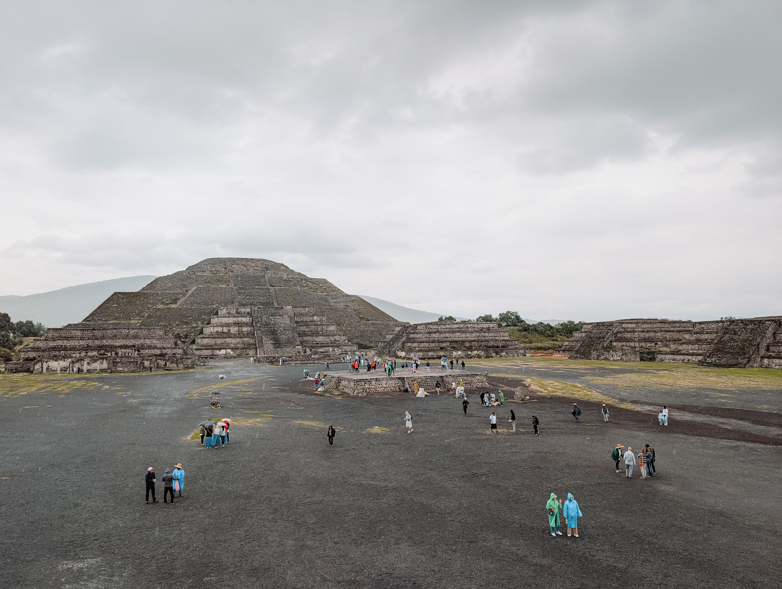 A large stone pyramid behind a large plaza as one of the top archaeological sites in Mexico City