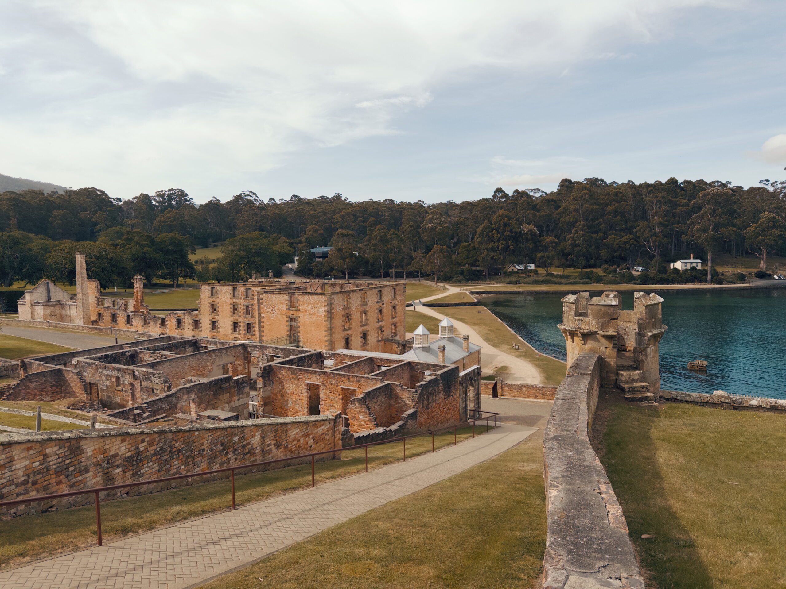 Overlooking historic brick ruins at the edge of a body of water - 5 Days Tasmania Itinerary