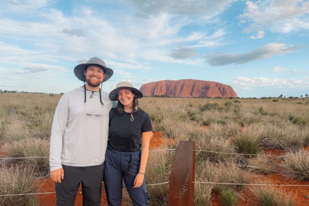 Standing in front of the rock of Uluru in the outback of Australia