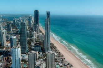 The view from a rooftop overlook of a city skyline along a beach coastline - Brisbane itinerary