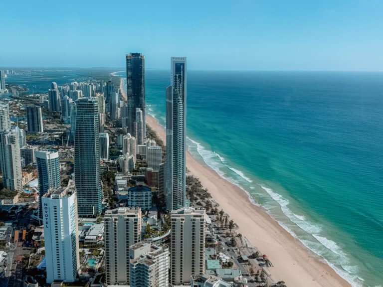 The view from a rooftop overlook of a city skyline along a beach coastline - Brisbane itinerary