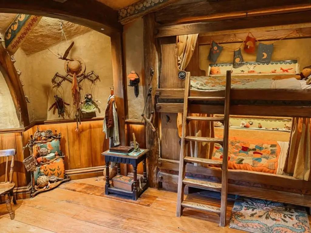 Wood bunk beds in a wood interior home in Hobbiton and visited as part of a Rotorua itinerary