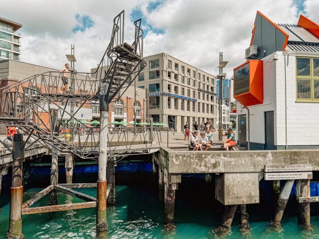 A diving platform on a boardwalk in front of the city of Wellington