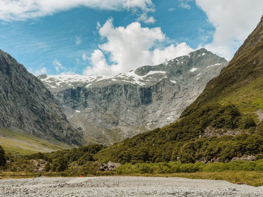 A mountain behind a forested valley in Fiordland National Park