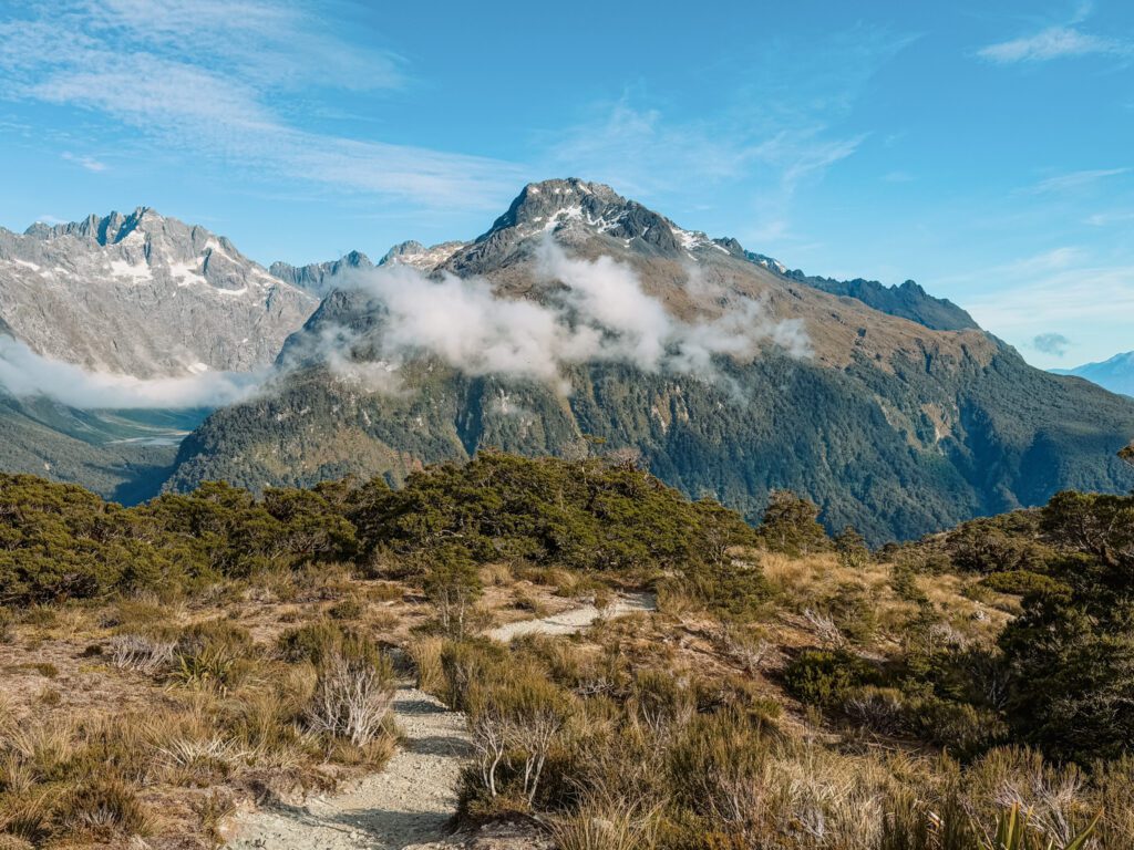 A mountain with some clouds covering it in Fiordland National Park