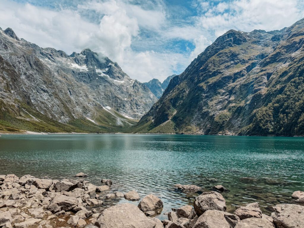 An alpine lake nestled between mountains in Fiordland National Park