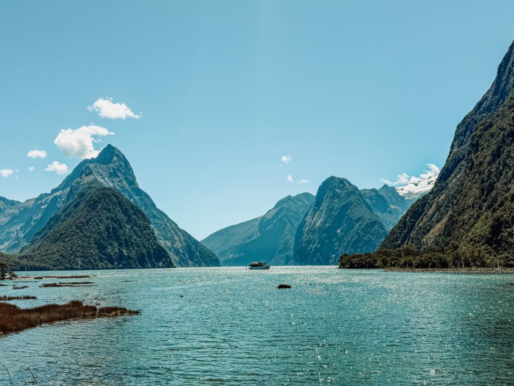 Mountains coming out of a body of water