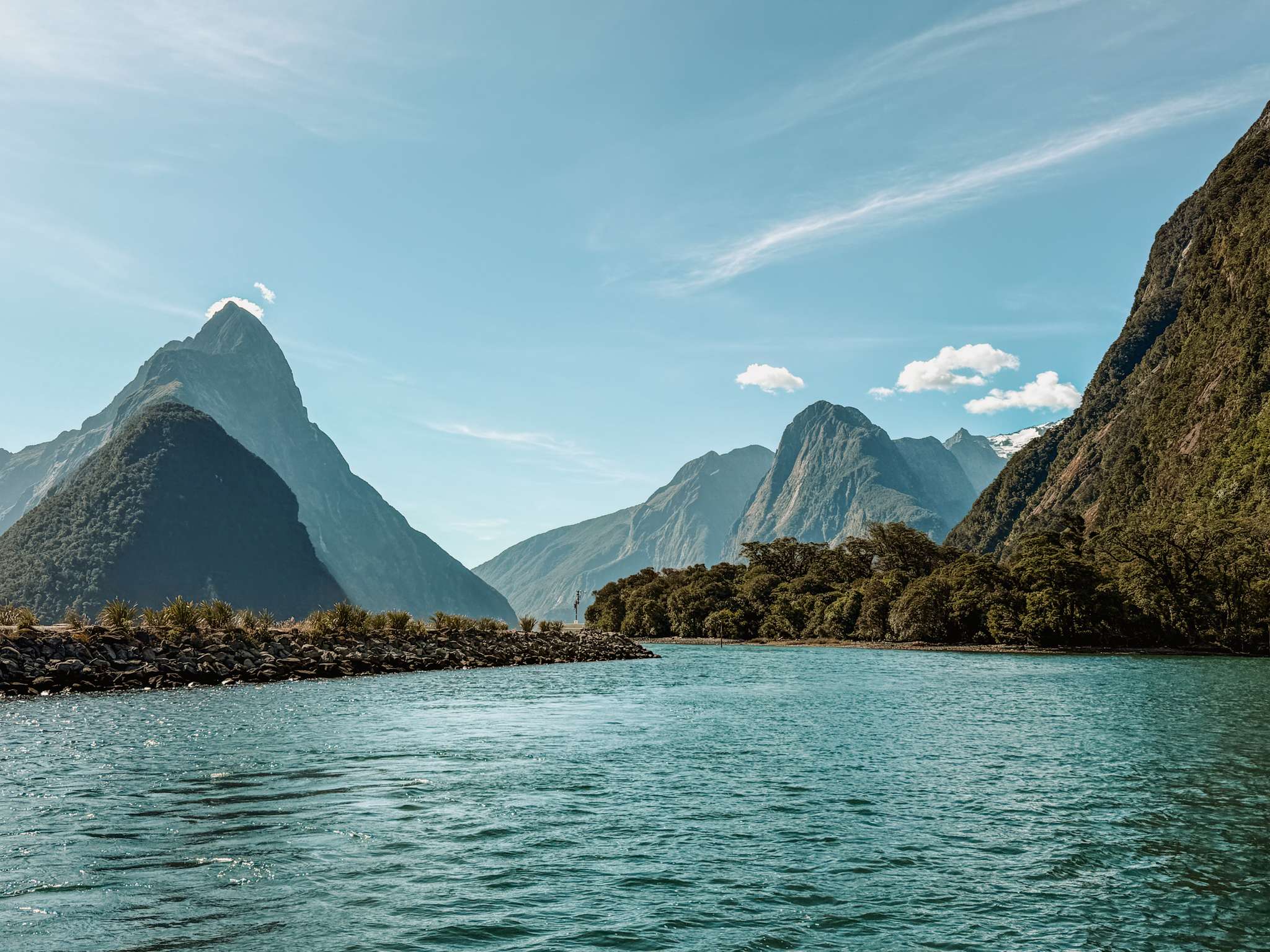 Pointy mountains over a lake as one of the top things to do in New Zealand