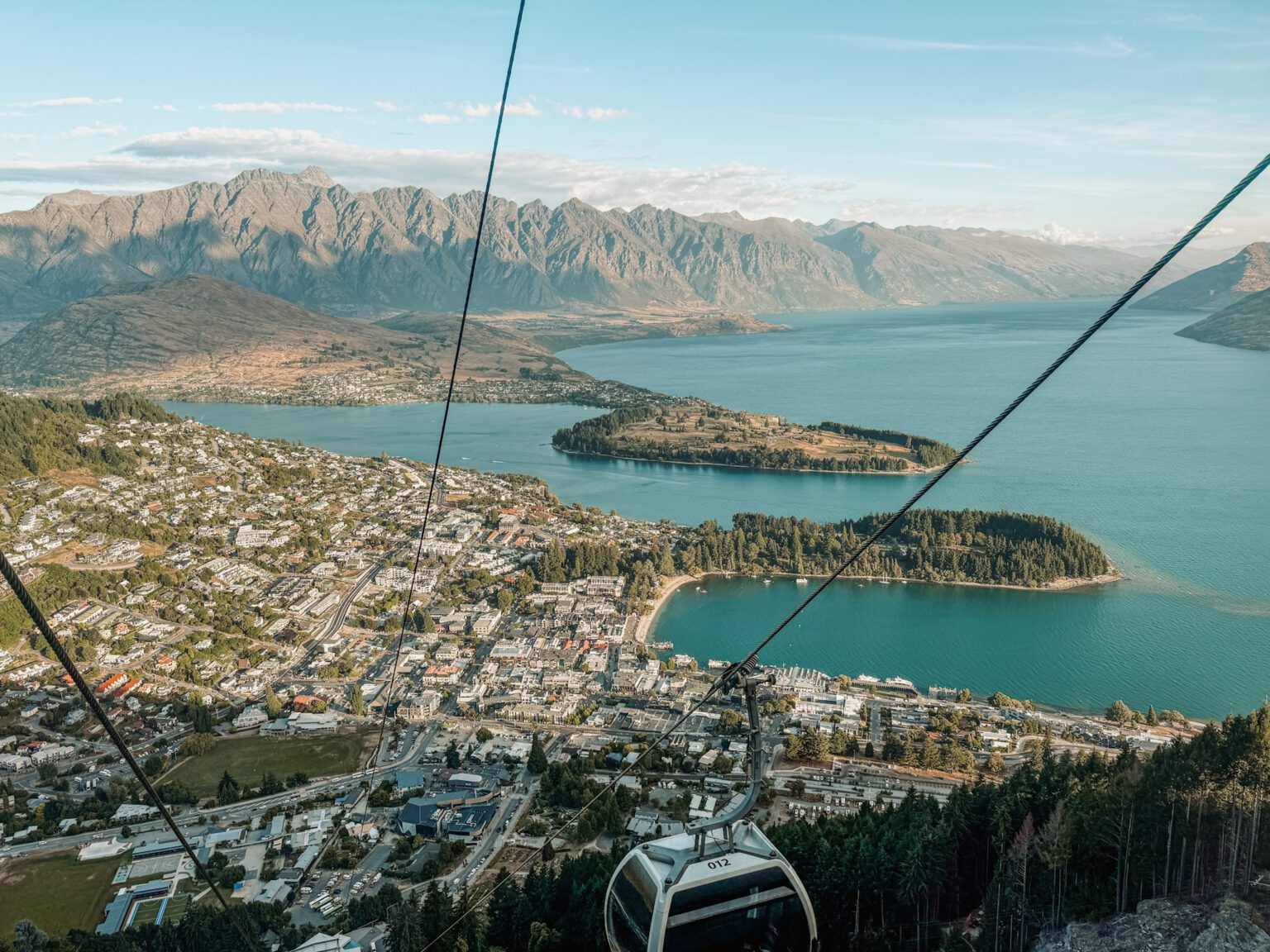 A gondola going over a town that can be done on the itinerary between Queenstown and Christchurch