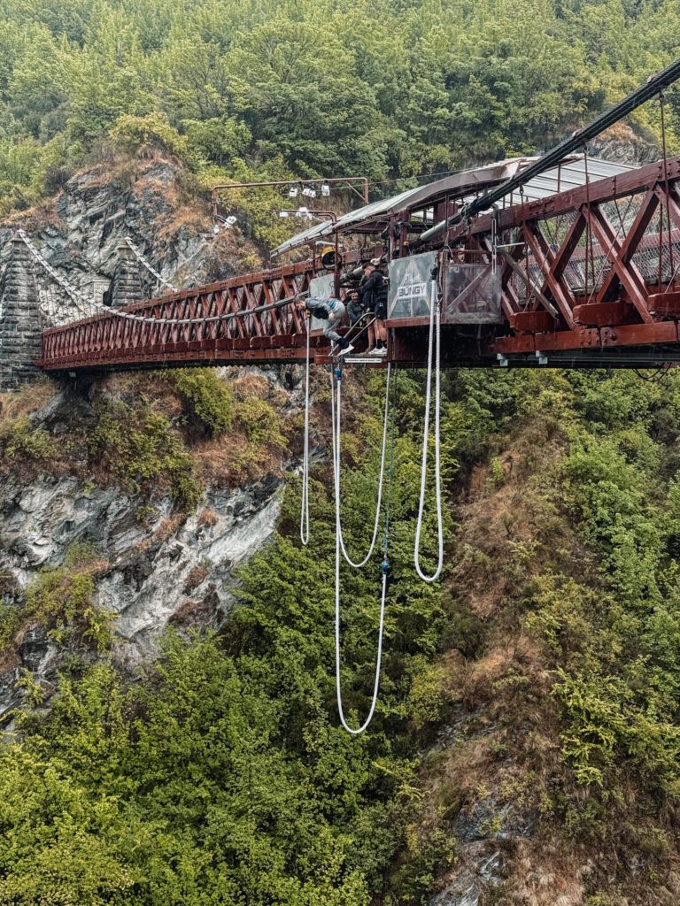 Someone bungy jumping off a bridge between Queenstown and Christchurch