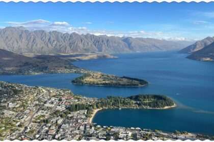 A town sitting on the edge of lake between mountains that can be visiting on your trip to Queenstown