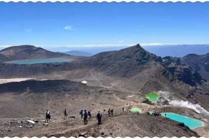 Turquoise pools nestled into the valley of a red rocky mountain outside of Taupo
