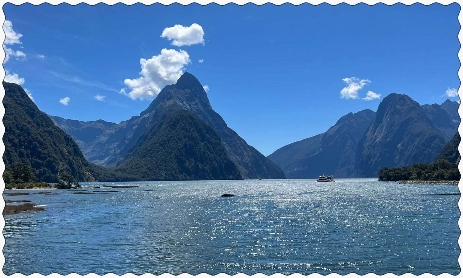 Pointy mountains over a lake in Milford Sound