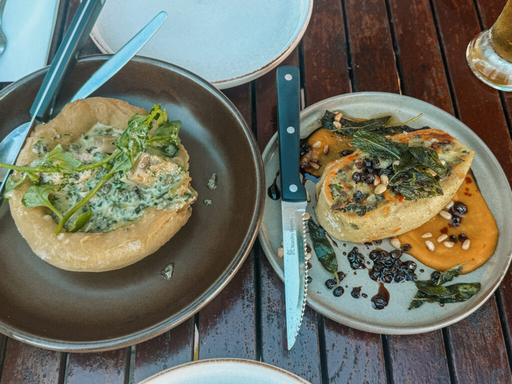Two plates of dishes at a restaurant located in one of the wine regions of New Zealand
