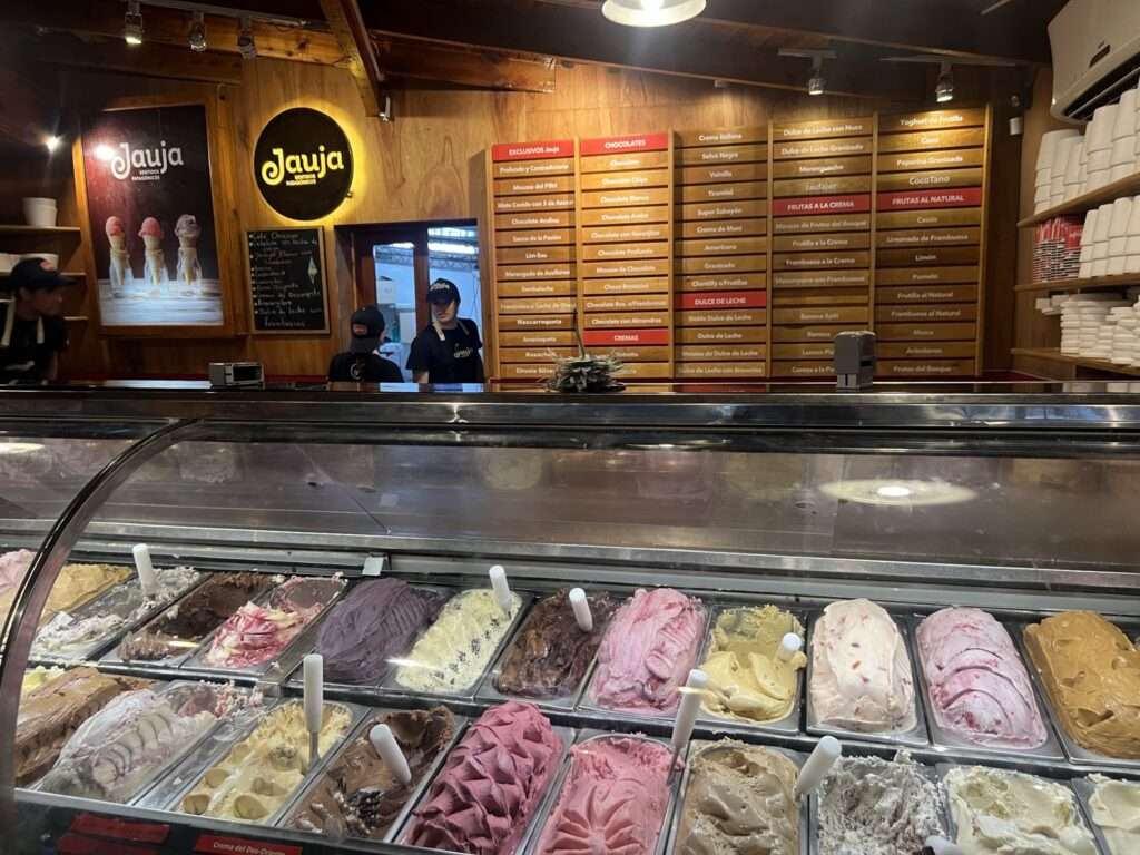 An ice cream counter with a variety of flavors of ice cream - Argentina food and drinks