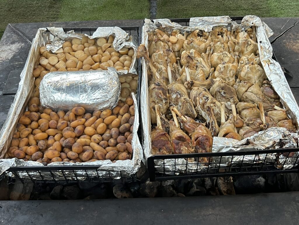 Two large platters full of vegetables and meat to represent new zealand food and drinks