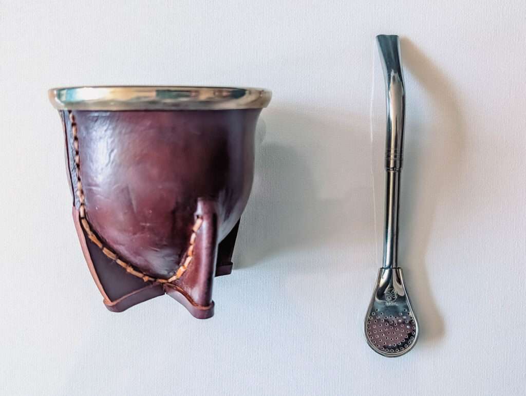 a gourd-like cup and metal straw - Argentina food and drinks