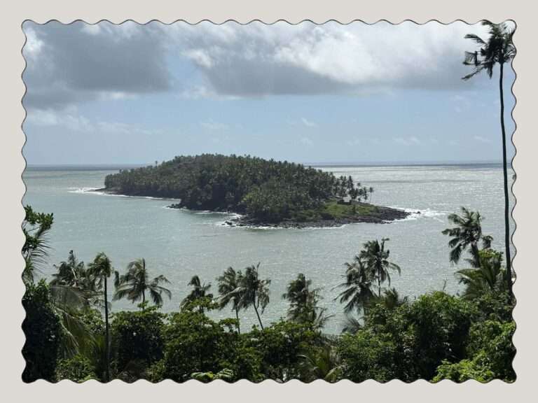 The view off a tropical island onto other islands in a turquoise ocean in French Guiana