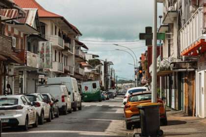 A road going between buildings in the center of things to do in Cayenne