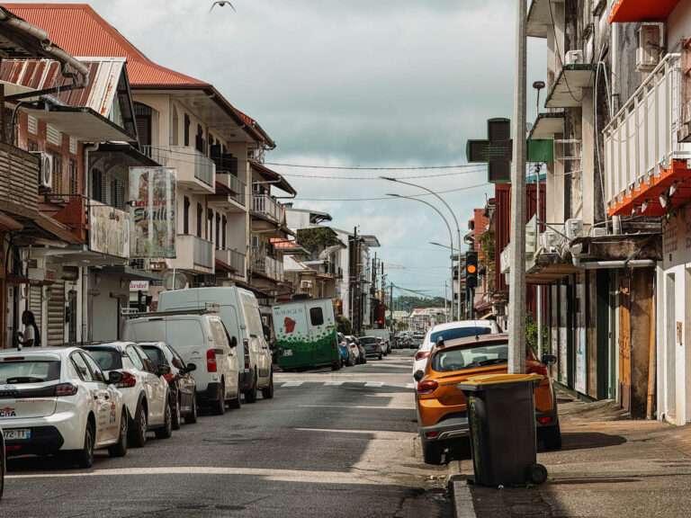 A road going between buildings in the center of things to do in Cayenne