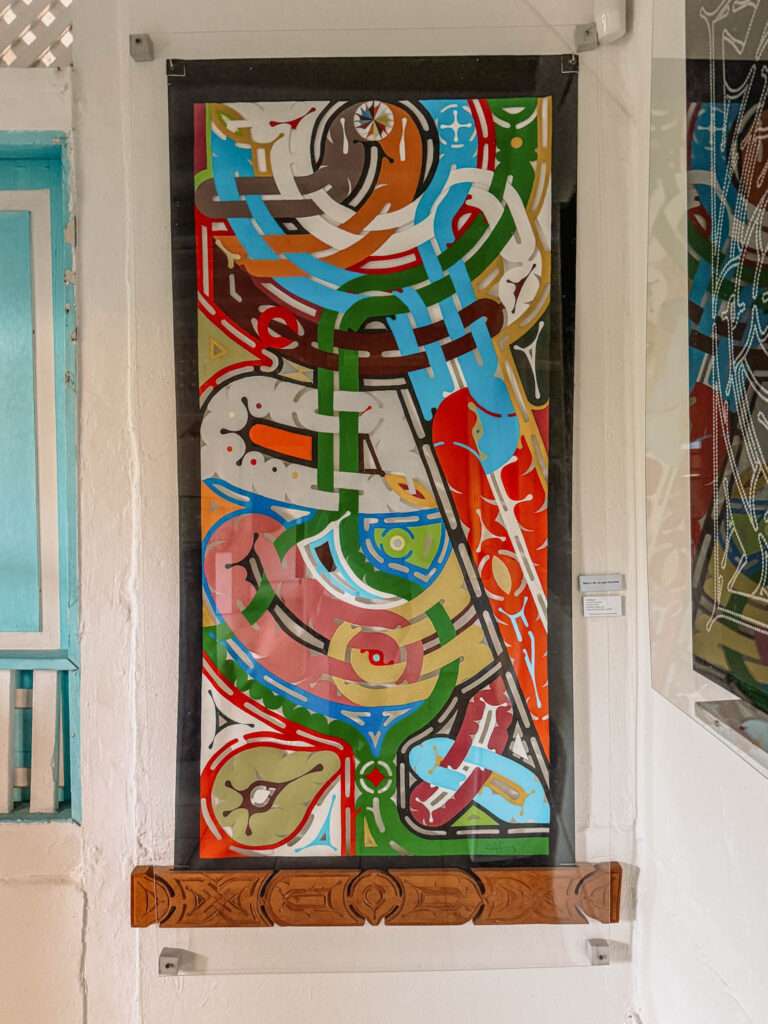 A colorful graphic painting in a museum as one of the things to do in Cayenne