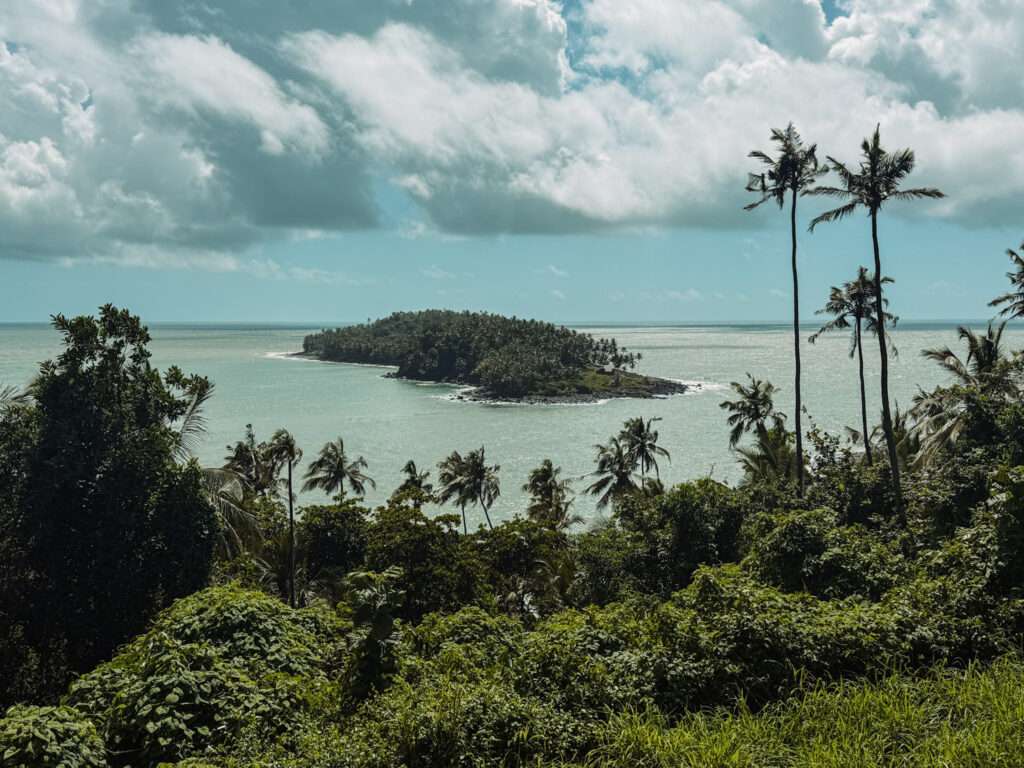 The view off a tropical island onto other islands in a turquoise ocean as one of the things to do in Kourou